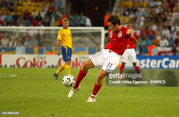 England's Joe Cole scores the opening goal of the game