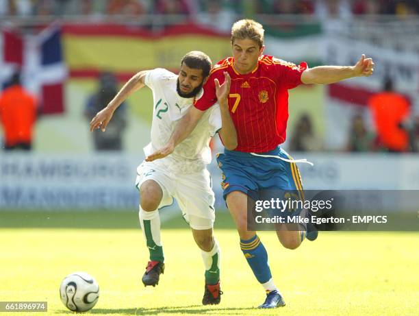 Spain's Sanchez Joaquin and Saudi Arabia's Abdulaziz Khathran battle for the ball