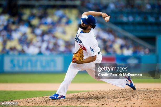 Kenley Jansen of the Los Angeles Dodgers throws a pitch to a Washington Nationals batter during the ninth inning in game three of the National League...