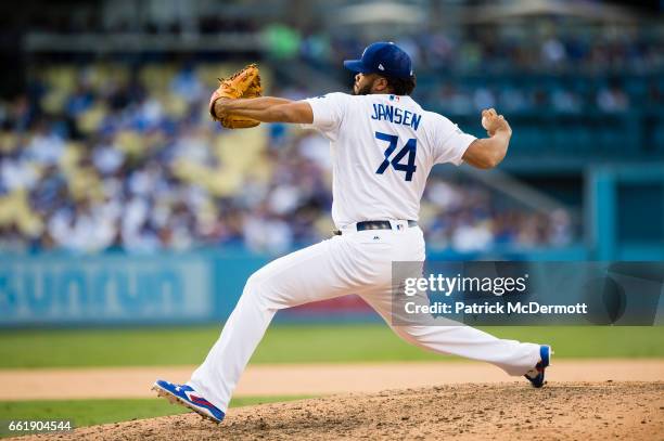 Kenley Jansen of the Los Angeles Dodgers throws a pitch to a Washington Nationals batter during the ninth inning in game three of the National League...