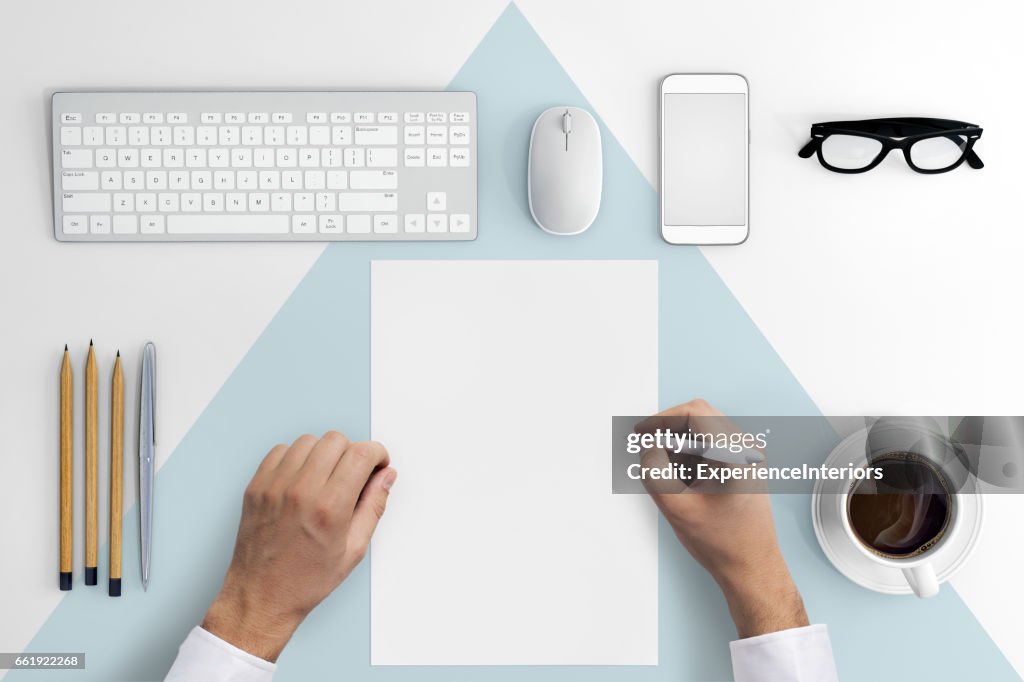 Knolling hands writing on a blank paper