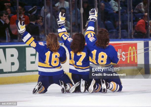 The Hanson Brothers from the movie "Slapshot" Jack Hanson , Steve Hanson and Jeff Hanson slide on the ice and wave to the crowd before a New York...