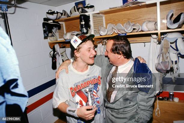 Alexei Kovalev of the New York Rangers celebrates with broadcaster Sam Rosen in the locker room after the Rangers defeated the Vancouver Canucks in...