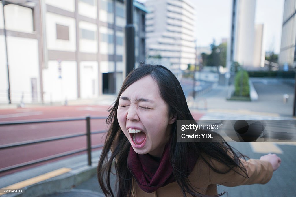 A woman cries loud outside.