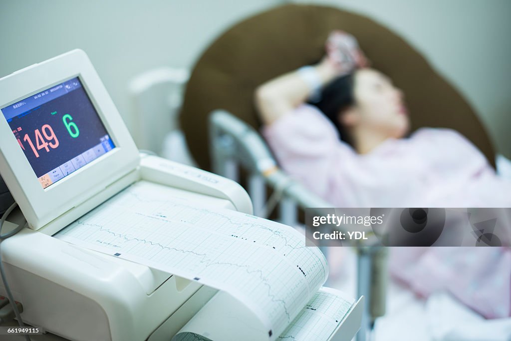 A woman starts to have contractions at hospital.