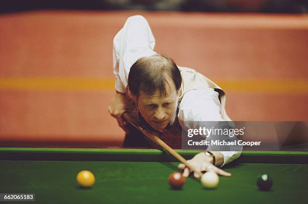 Alex Higgins of Northern Ireland lines up the cue ball during his World Snooker Championship first round match against Ken Doherty on 16 April 1994...