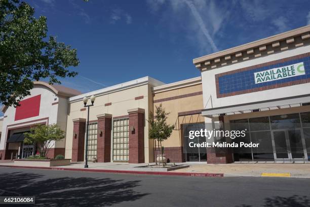 two retail storefronts available for lease in a strip mall - for lease sign stock pictures, royalty-free photos & images