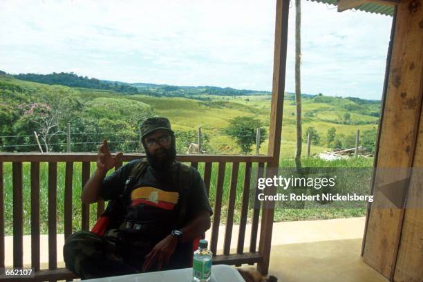 Alfonso Cano, a former anthropology professor and now number three in the FARC rebel command, speaks with a reporter at the FARC headquarters August...