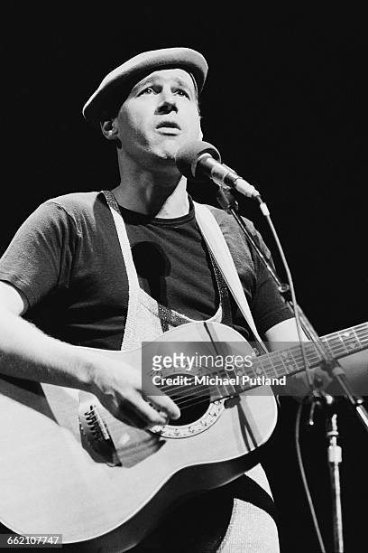 English writer, comedian and musician Neil Innes performing in 'The Secret Policeman's Other Ball', at the Drury Lane theatre, London, 9th September...