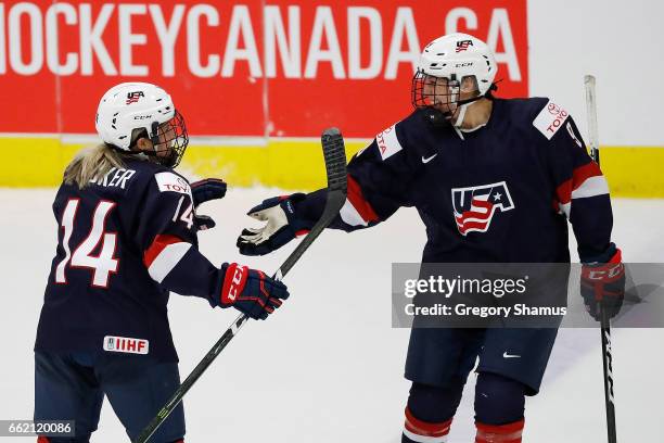 Brianna Decker of United States celebrates her second period goal against Canada with Megan Bozek at the 2017 IIHF Womans World Championships at USA...