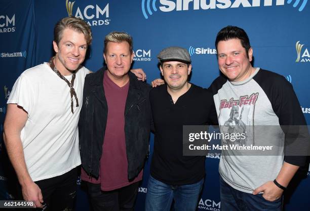 Musicians Joe Don Rooney and Gary LeVox of Rascal Flatts, SiriusXM host Al Skop, and Jay DeMarcus of Rascal Flatts pose during SiriusXM's The Highway...