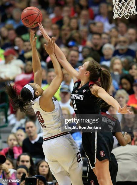 Alanna Smith of the Stanford Cardinal blocks a shot by Allisha Gray of the South Carolina Gamecocks in the second half during the semifinal round of...