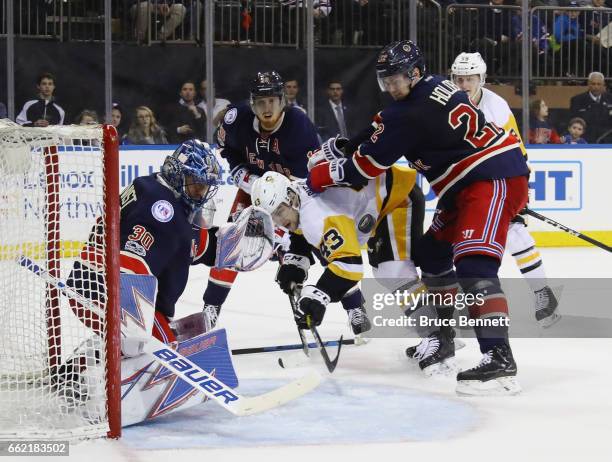 Conor Sheary of the Pittsburgh Penguins is stopped by the New York Rangers during the third period at Madison Square Garden on March 31, 2017 in New...