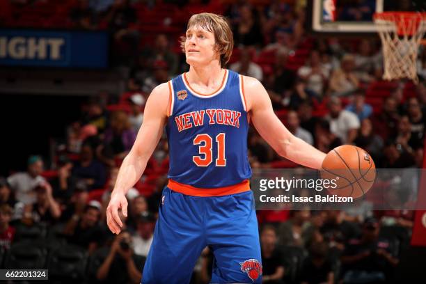 Ron Baker of the New York Knicks handles the ball during the game against the Miami Heat on March 31, 2017 at AmericanAirlines Arena in Miami,...