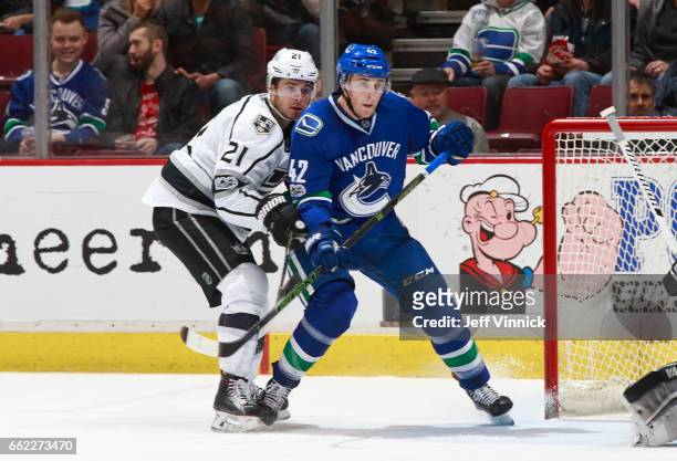 Drew Shore of the Vancouver Canucks checks brother Nick Shore of the Los Angeles Kings during their NHL game at Rogers Arena March 31, 2017 in...
