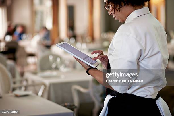 waiter typing on digital tablet - waitress taking order stock pictures, royalty-free photos & images