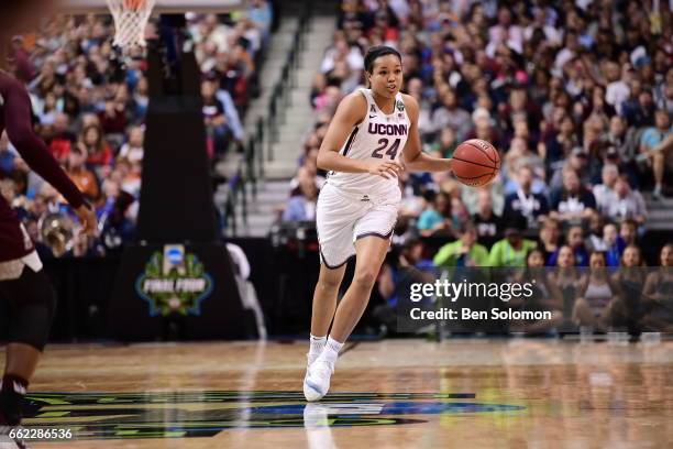 Napheesa Collier of the Connecticut Huskies dribbles down court against the Mississippi State Bulldogs during the semifinal round of the 2017 NCAA...