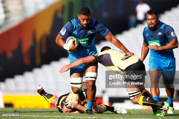 Patrick Tuipulotu of the Blues is tackled during the round six Super Rugby match between the Blues and the Force at Eden Park on April 1, 2017 in...