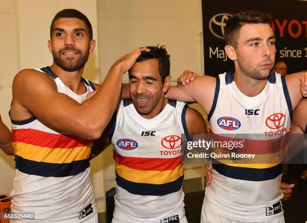 Curtly Hampton, Eddie Betts and Rory Atkins of the Crows sing the song after winning the round two AFL match between the Hawthorn Hawks and the...