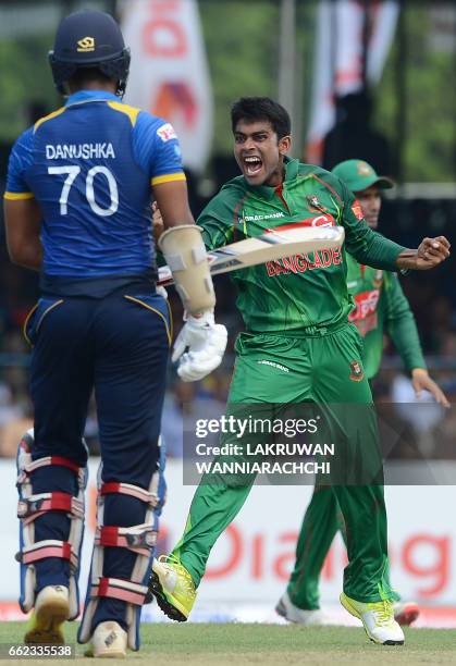 Bangladesh cricketer Mehedi Hasan celebrates after he dismissed Sri Lankan batsman Danushka Gunathilaka during the third and final one day...