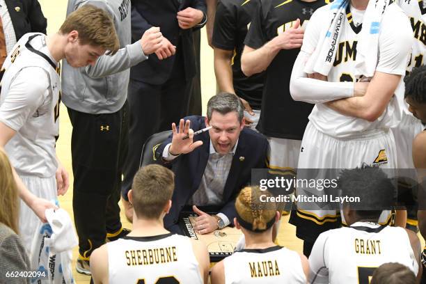 Head coach Ryan Odom of the UMBC Retrievers talks to his players during a time out of the Semi-final of the CollegeInsider.com Tournament against the...