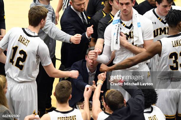 Head coach Ryan Odom huddles with his players during a time out of the Semi-final of the CollegeInsider.com Tournament against the UMBC Retrievers at...