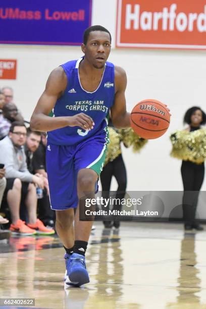 Joseph Kilgore of the Texas A&M-CC Islanders dribbles the ball up court during the Semi-final of the CollegeInsider.com Tournament against the UMBC...