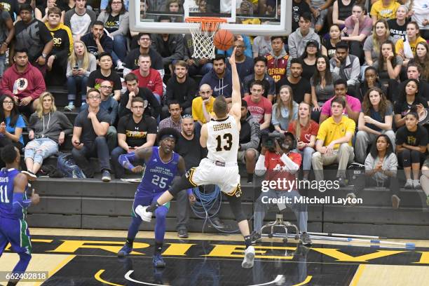 Joe Sherburne of the UMBC Retrievers drives to the basket during the Semi-final of the CollegeInsider.com Tournament against the Texas A&M-CC...