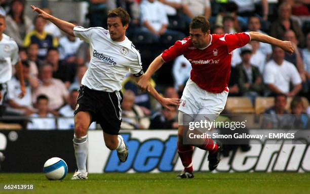 Derby County's Matt Oakley and Nottingham Forest's Grant Holt in action