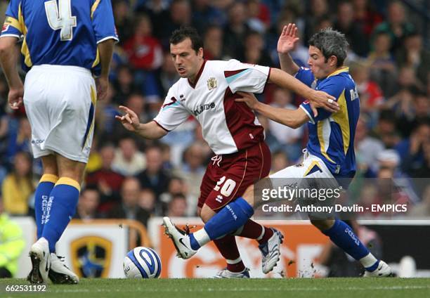 Burnley's Robbie Blake and Cardiff City's Kevin McNaughton battle for the ball