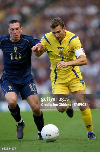 Scotland's Scott Brown and Ukraine's Andriy Shevchenko battle for the ball