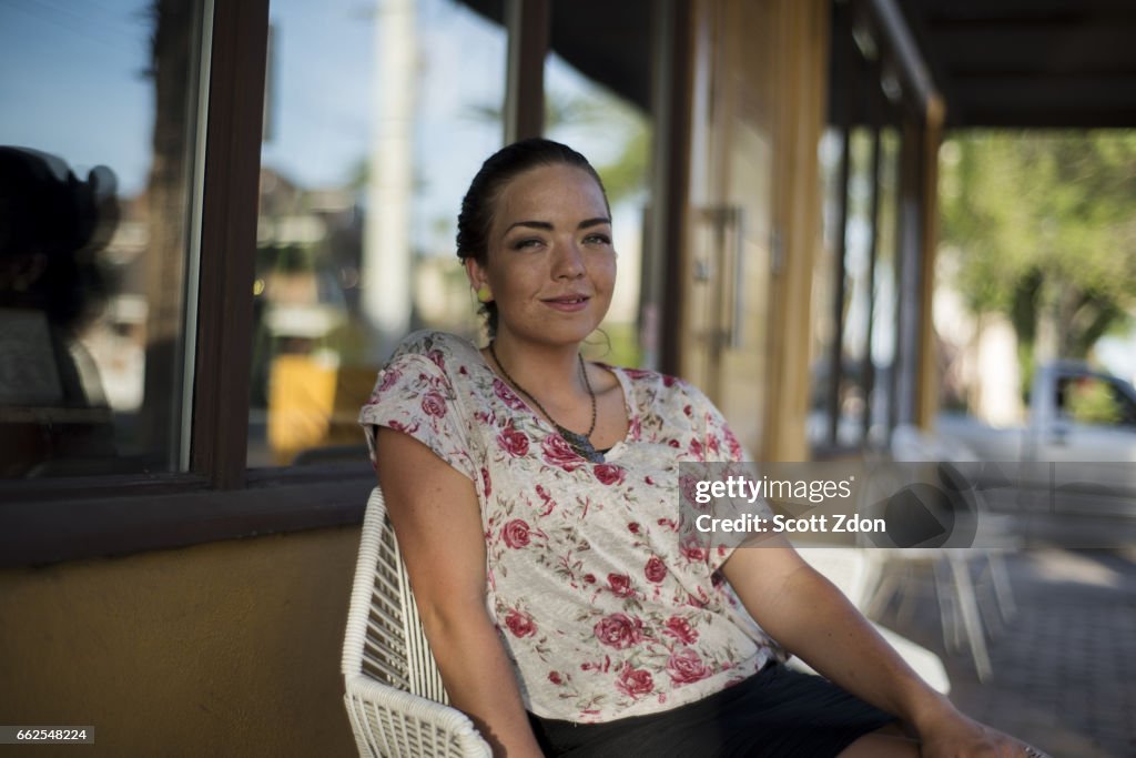 Woman sitting outside cafe