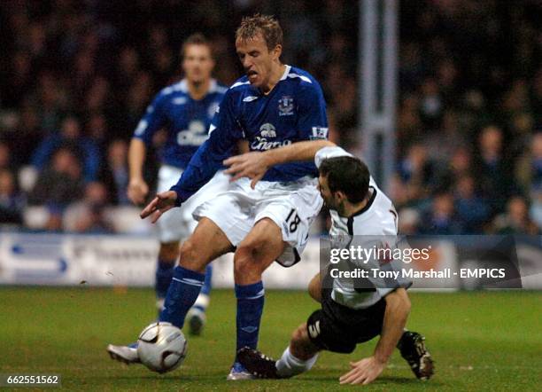 Luton Town's Alan Goodall and Everton's Phil Neville battle for the ball.