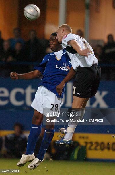 Everton's Victor Anichebe and Luton Town's Jaroslaw Fojut battle for the ball.