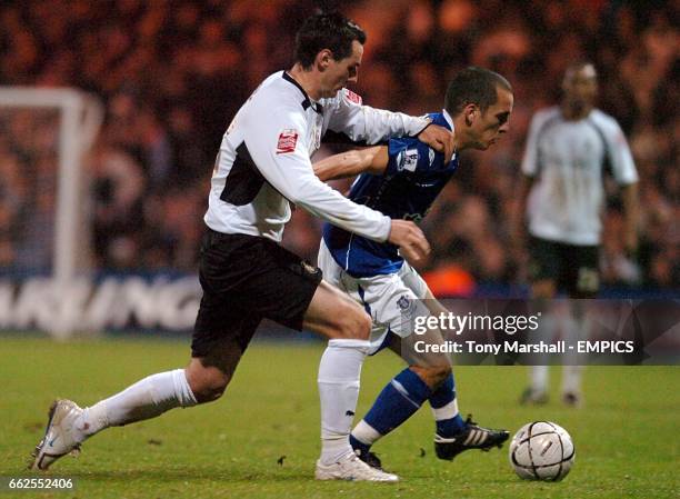 Luton Town's Matthew Spring and Everton's Leon Osman battle for the ball.
