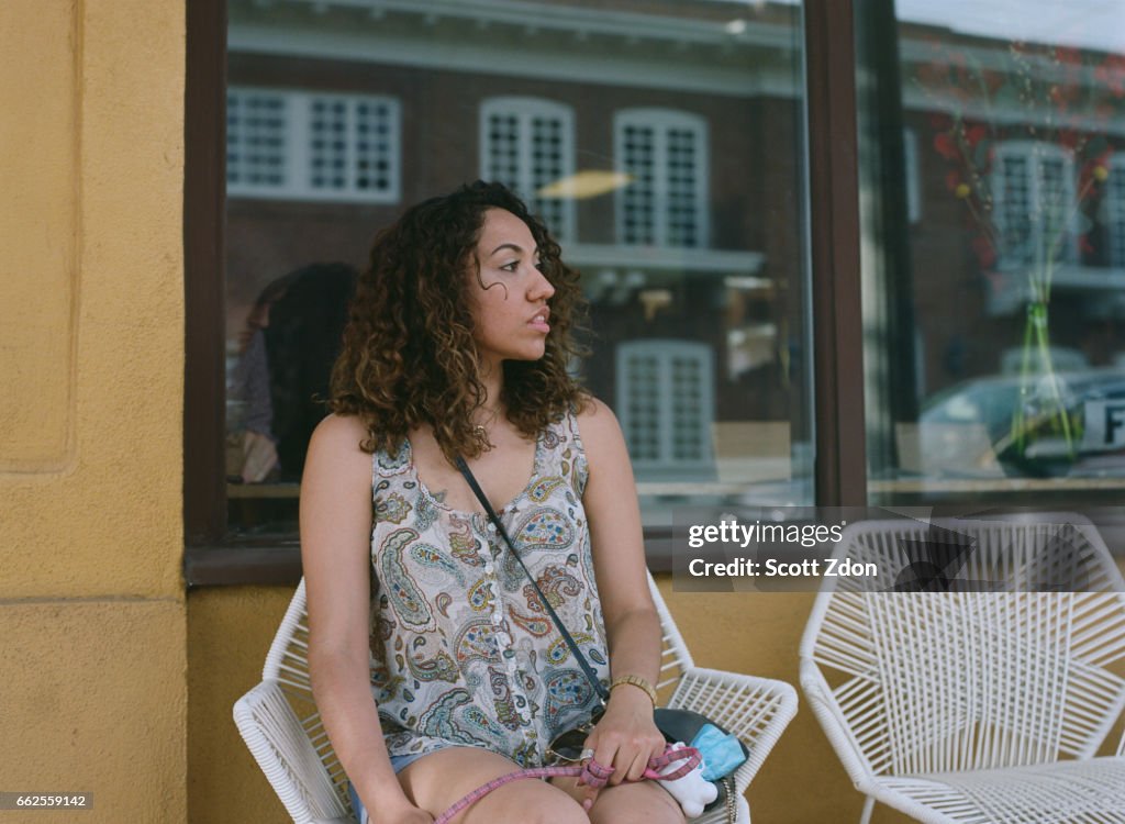 Woman sitting outside cafe