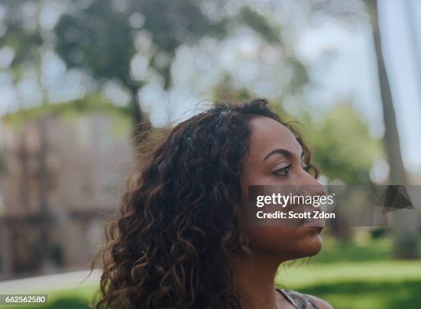 close-up of hispanic woman in park - scott zdon bildbanksfoton och bilder