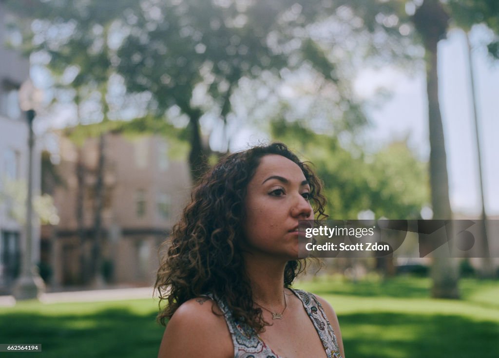 Close-up of hispanic woman in park