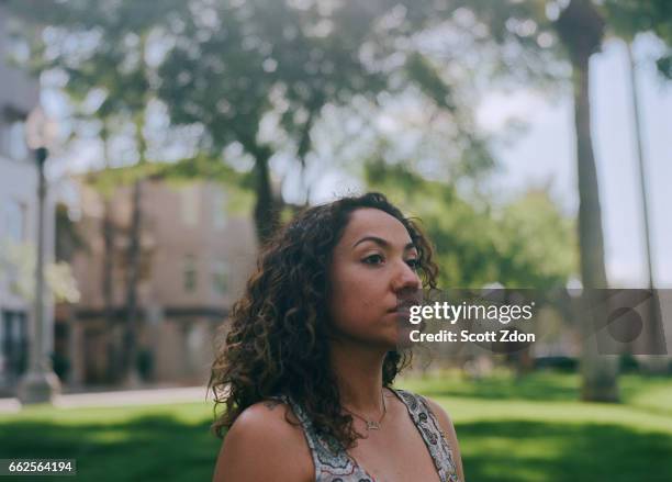 close-up of hispanic woman in park - scott zdon bildbanksfoton och bilder