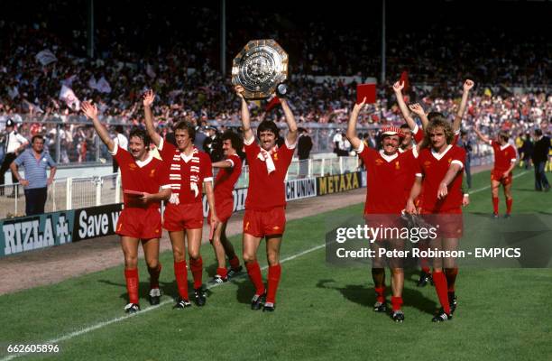 Liverpool players celebrate with the charity shield. Jimmy Case, Phil Neal, Terry McDermott, David Johnson , Alan Kennedy and Phil Thompson