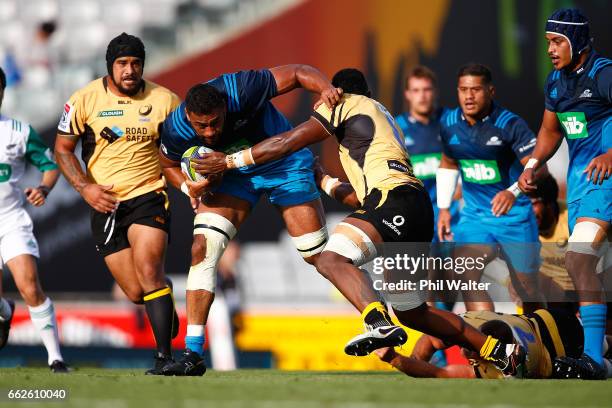 Patrick Tuipulotu of the Blues is tackled during the round six Super Rugby match between the Blues and the Force at Eden Park on April 1, 2017 in...