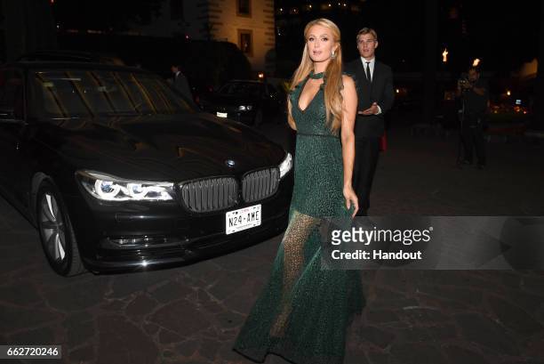 In this handout image supplied by Formula E, Paris Hilton attends a dinner hosted by the FIA Formula E Championship Mexico City ePrix on March 31,...