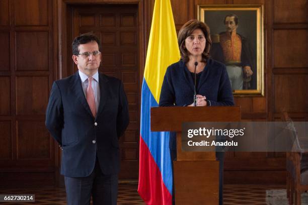 Colombian Foreign Affairs Minister Maria Angela Holguin delivers a speech accompany by Colombia's ambassador to Venezuela, Ricardo Lozano during a...