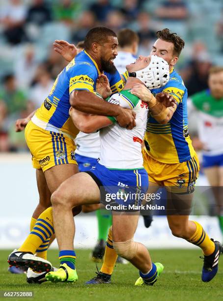 Jarrod Croker of the Raiders is tackled during the round five NRL match between the Canberra Raiders and the Parramatta Eels at GIO Stadium on April...