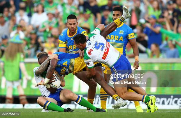 Semi Radradra of the Eels is tackled during the round five NRL match between the Canberra Raiders and the Parramatta Eels at GIO Stadium on April 1,...