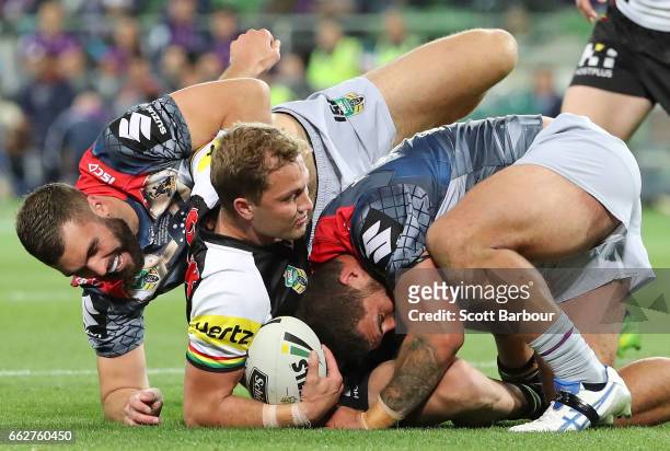 Matt Moylan of the Panthers is tackled during the round five NRL match between the Melbourne Storm and the Penrith Panthers at AAMI Park on April 1,...
