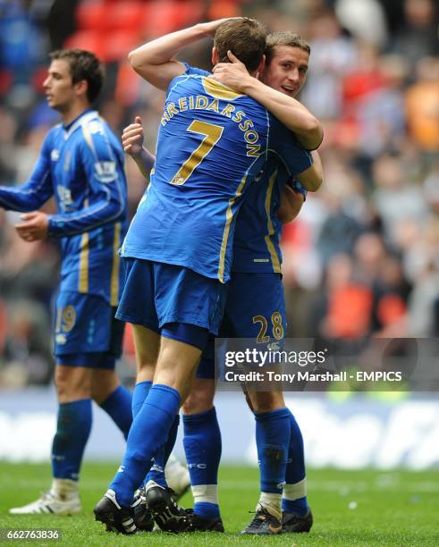 Portsmouth's Hermann Hreidarsson and Sean Davis celebrate victory after the final whistle