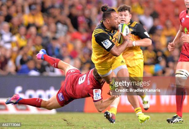 Matt Proctor of the Hurricanes breaks through the defence during the Super Rugby round six match between the Reds and the Hurricanes at Suncorp...