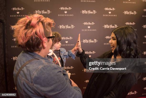 Kat Von D greets young fan Elsie and her mum at Debenhams, Henry Street on April 1, 2017 in Dublin, Ireland.