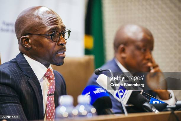 Malusi Gigaba, South Africa's finance minister, left, speaks during a news conference in Pretoria, South Africa, on Saturday, April 1, 2017....